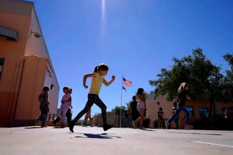 Whittier Elementary School students enjoy recess, Tuesday, Oct. 18, 2022 in Mesa, Ariz. (AP Photo/Matt York,File)