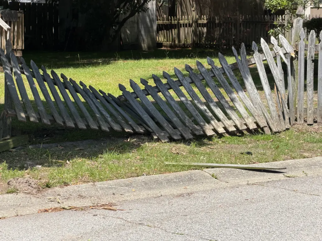 A fence was damaged in a chase between Fayetteville police officers and an unknown suspect. (Justin Moore)