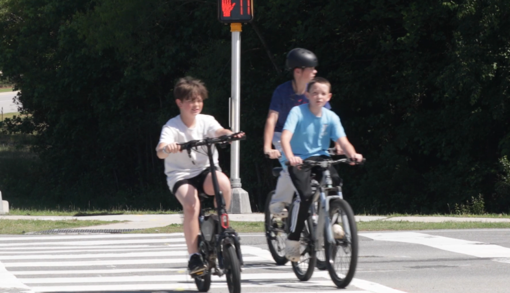 Kid on an electric bicycle, or e-bike (Credit: Town of Holly Springs)
