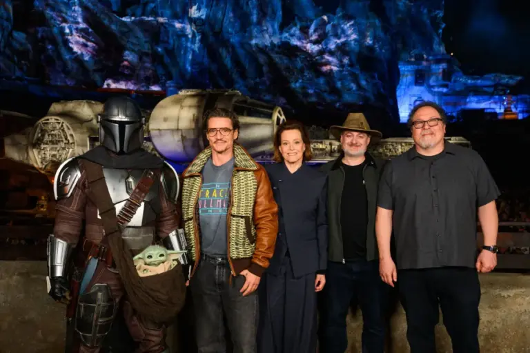 “Star Wars: The Mandalorian and Grogu” actors Pedro Pascal and Sigourney Weaver, along with President and CCO of Lucasfilm Dave Filoni and Director Jon Favreau pose with The Mandalorian and Grogu inside Star Wars: Galaxy’s Edge at Disneyland park in Anaheim, Calif., on May 16, 2026. A new mission aboard Millennium Falcon: Smugglers Run with Mandalorian and Grogu debuts May 22, 2026, at Disneyland Resort and Walt Disney World Resort, coinciding with the premiere of Lucasfilm’s new film, “Star Wars: The Mandalorian and Grogu.” (Richard Harbaugh/Disneyland Resort)