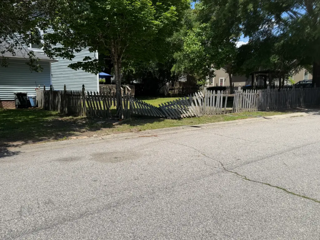 A fence was damaged in a chase between Fayetteville police officers and an unknown suspect. (Justin Moore)