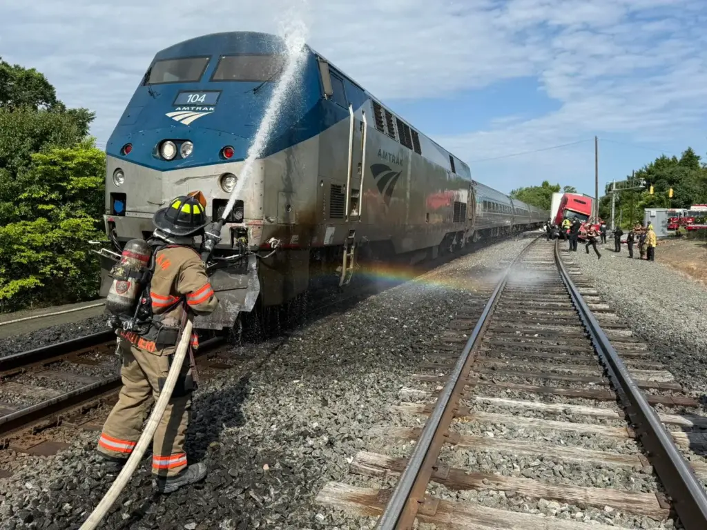 Durham firefighters hosing debris off of Amtrak train (Photos courtesy of the Durham Fire Department)