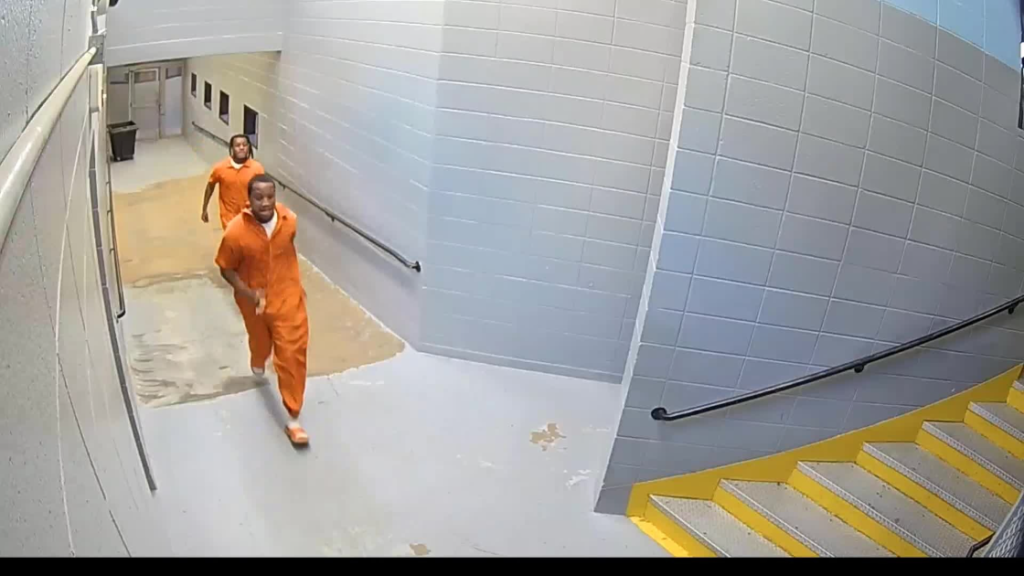 The video, provided by the FBI on Thursday, shows 33-year-old Michael Lewis Miles Jr. and 21-year-old LiShawn Knott running through a hallway of the Vance County Detention Center in Henderson. (FBI)