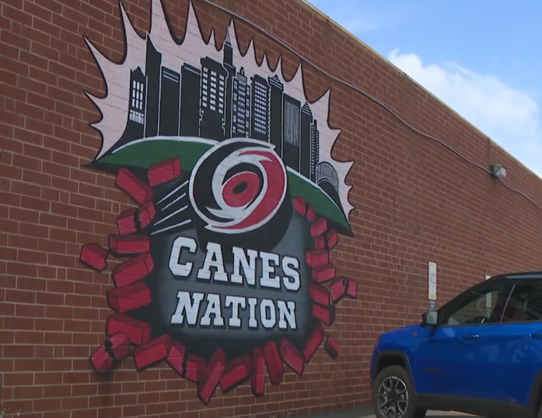 If you've been to Glenwood South, you are likely familiar with the Canes Nation mural on the side of Teets bar. It's been three years since Carly Jaye painted it.