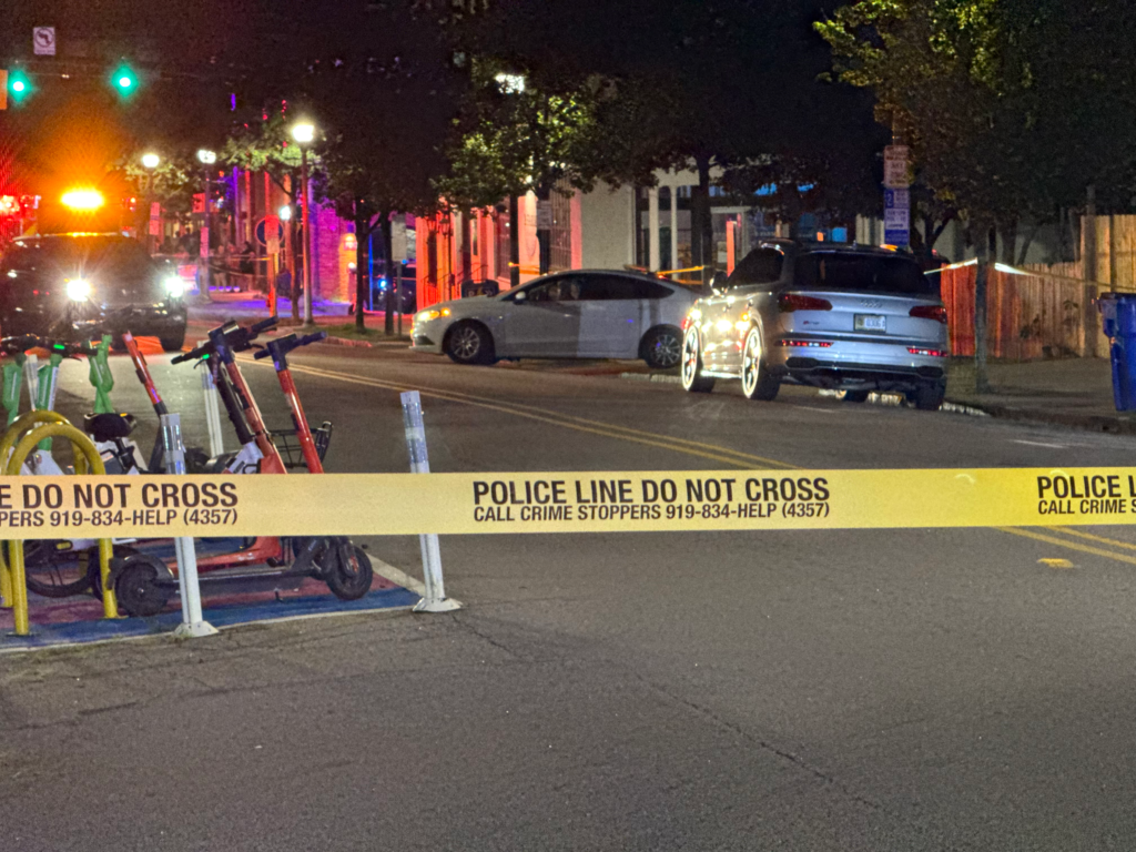 Raleigh police investigate a shooting in the 1100 block of Glenwood Avenue that hurt two people early Saturday morning. (Cole Sams)