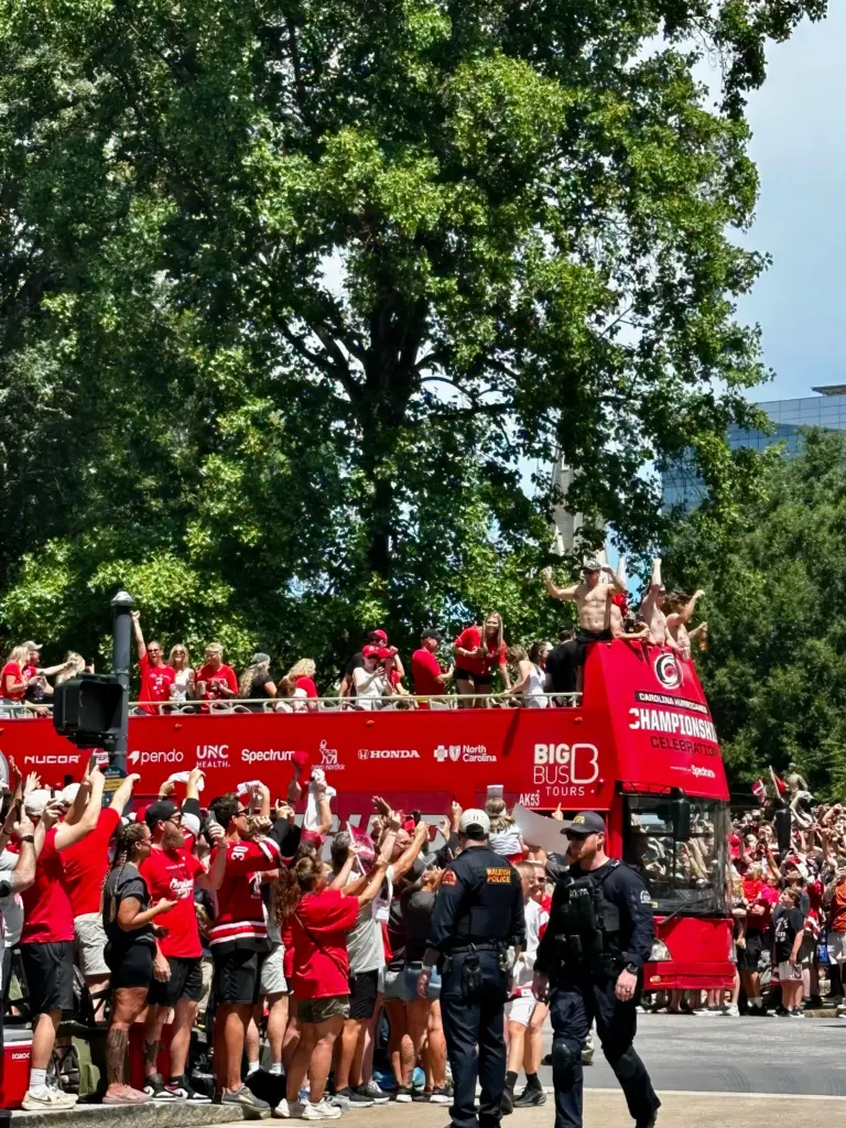 Caniacs cheer as members of the Carolina Hurricanes ride through the streets of Raleigh during the victory parade on Saturday, June 20, 2026. (Russ Bowen)