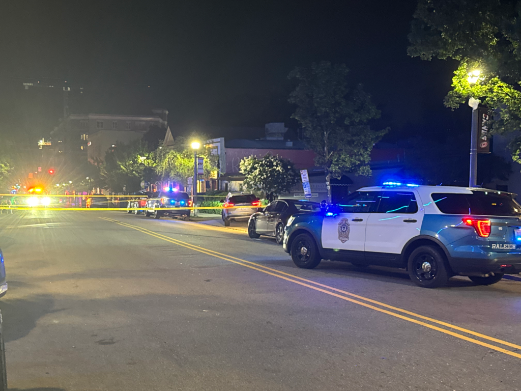 Raleigh police investigate a shooting in the 1100 block of Glenwood Avenue that hurt two people early Saturday morning. (Cole Sams)