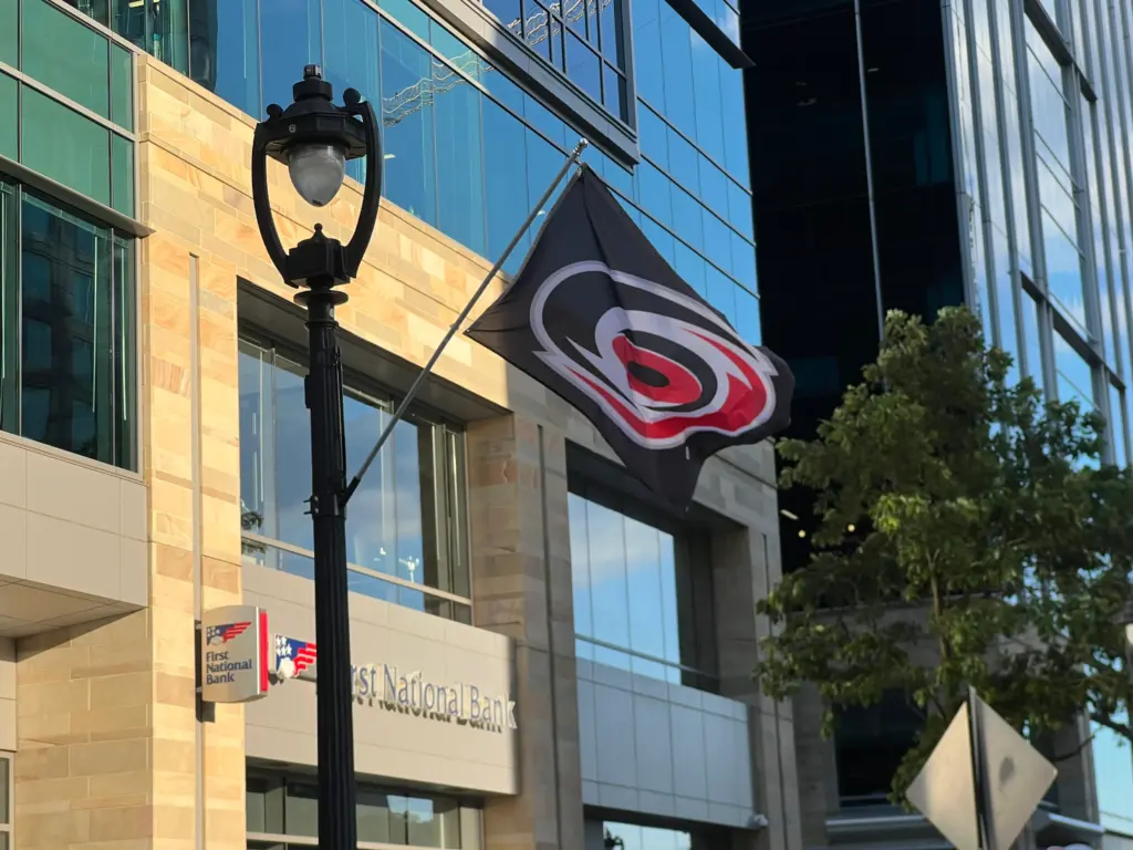 A Carolina Hurricanes flag flies on a street light in Raleigh. (Greg Funderburg)