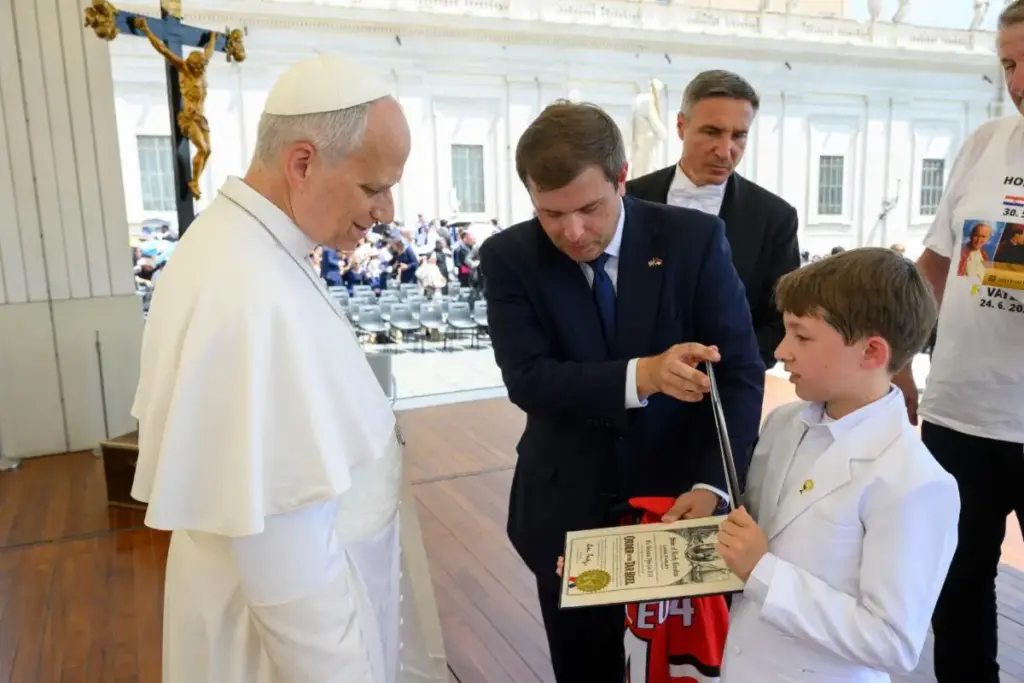 NC Labor Commissioner Luke Farley presents the Order of the Tar Heel award to Pope Leo XIV. (Photo courtesy of NCDOL and Vatican Media)