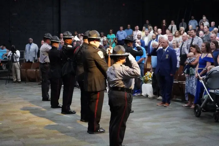 Members of the Chatham County Sheriff's Office Honor Guard render a final salute to Sheriff Mike Roberson at the conclusion of his retirement ceremony July 15 at Northwood High School, honoring his nearly four decades of public service and leadership. (Chatham County Sheriff's Office)
