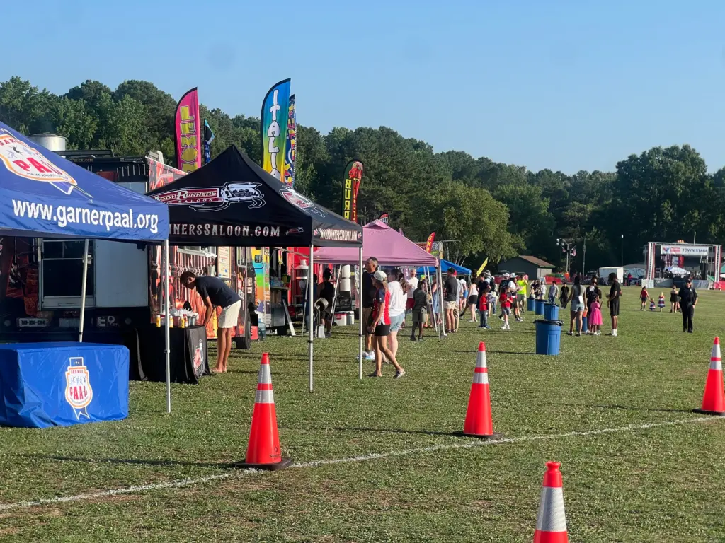 Several organizations set up tents at the Garner fireworks event at Lake Benson Park. (Greg Funderburg)