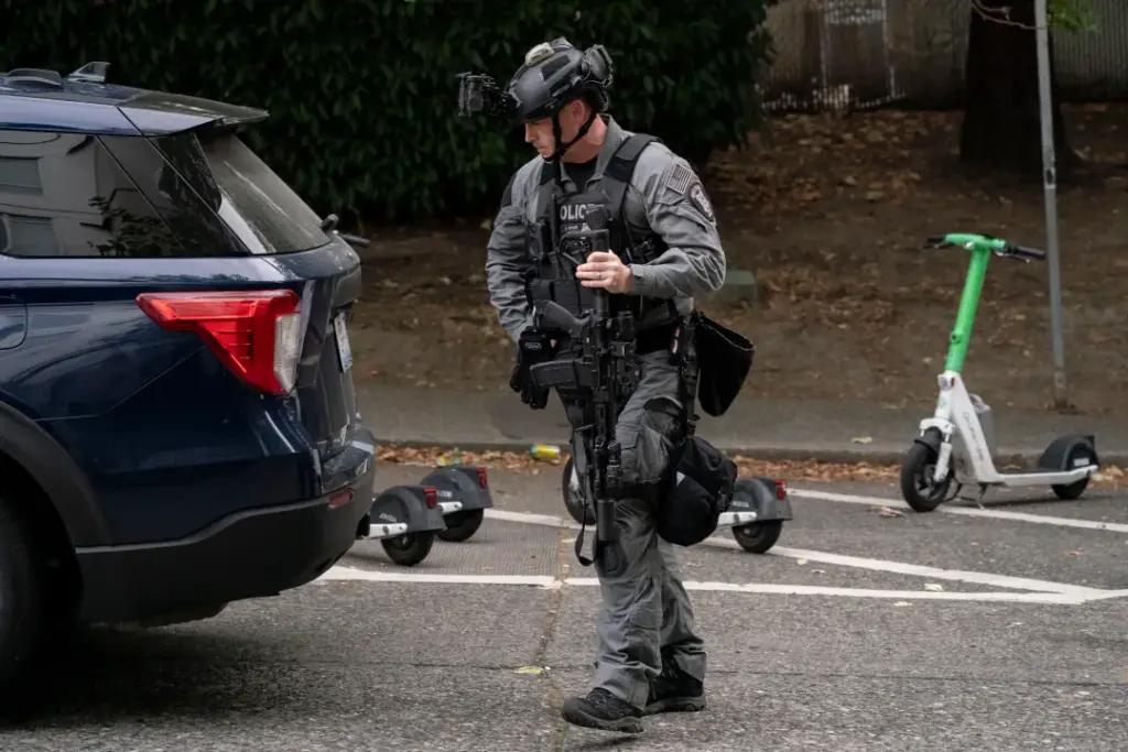A police officer arrives after a shooting at the Bite of Seattle food festival