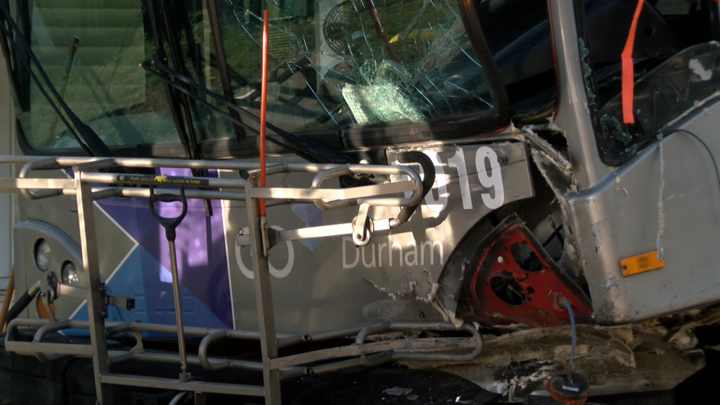 A GoDurham bus with heavy front-end damage after a crash on North Driver Street and Holloway Street. (Ben Bokun)